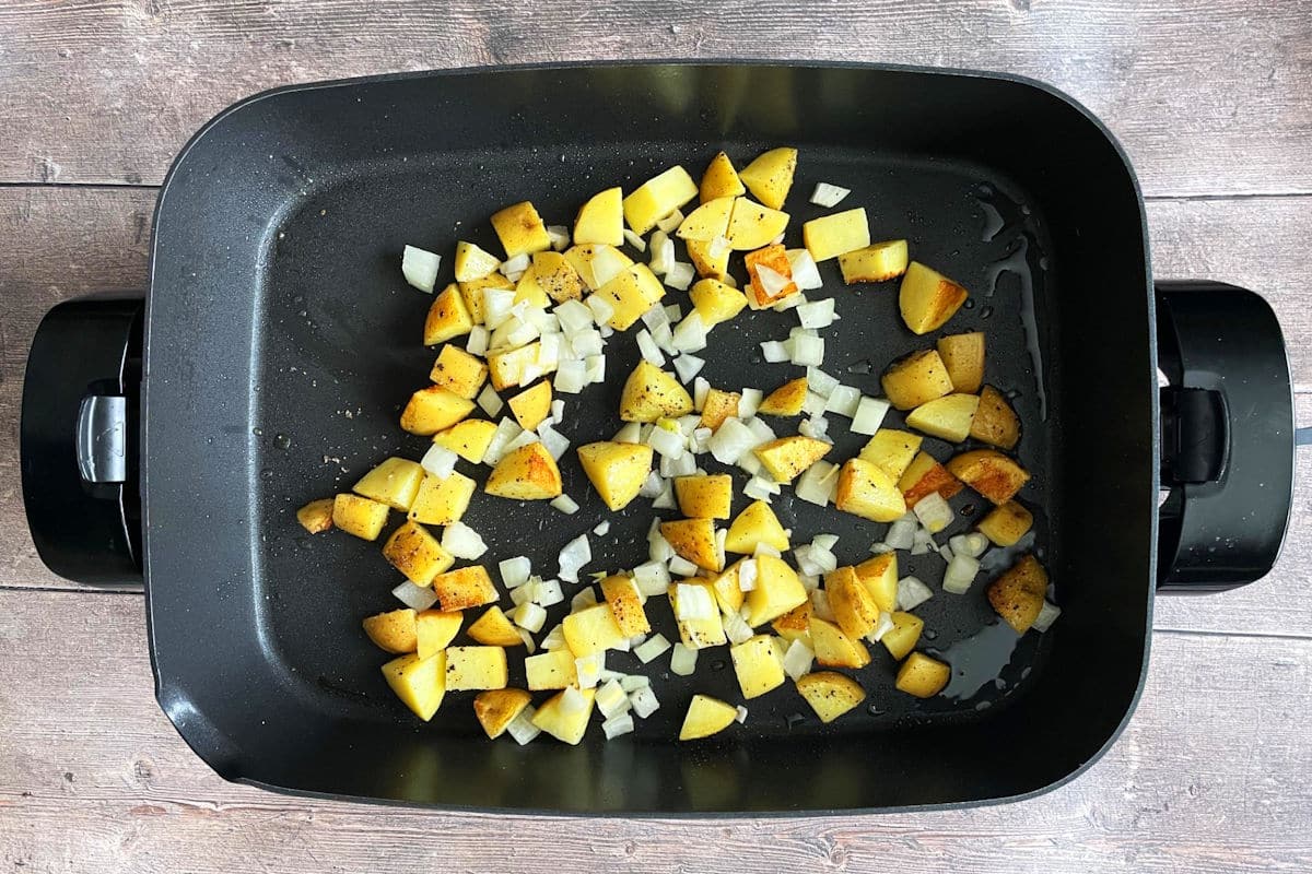 Potatoes and onions in skillet.