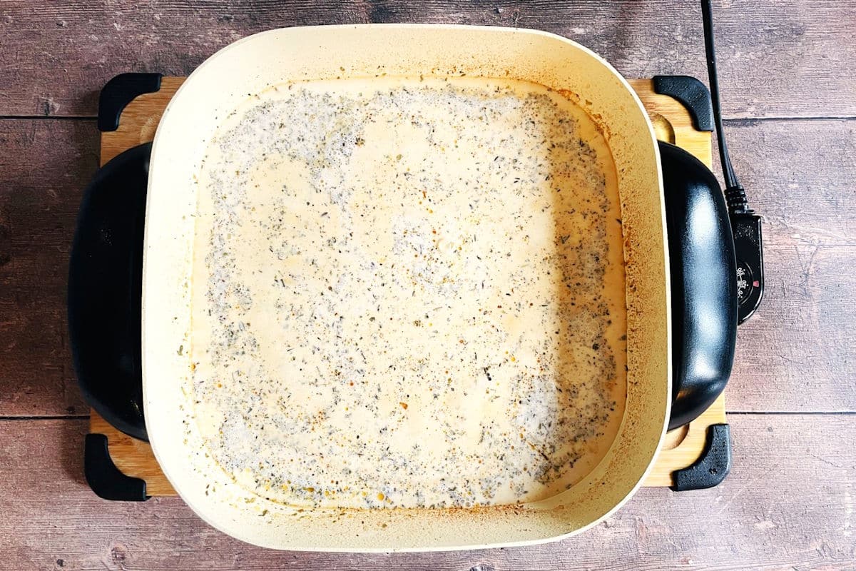 Tuscan cream sauce in electric skillet.