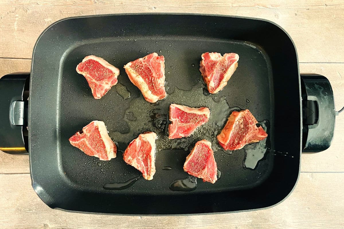 Lamb loin chops in electric skillet.