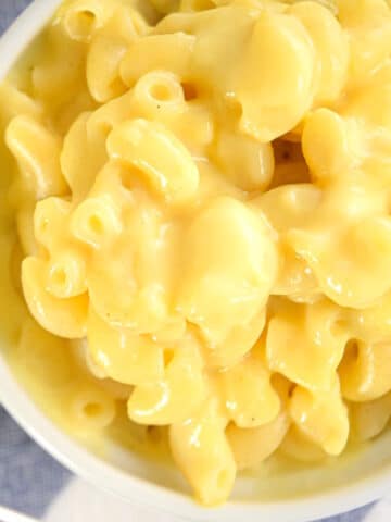 Creamy electric skillet mac and cheese in white dish.