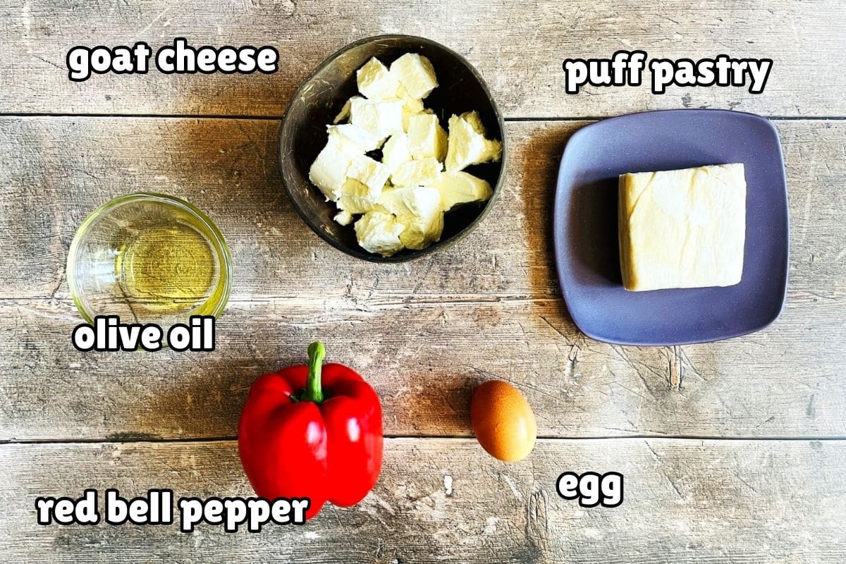 Stuffed puff pastry triangle ingredients labeled on wooden background.