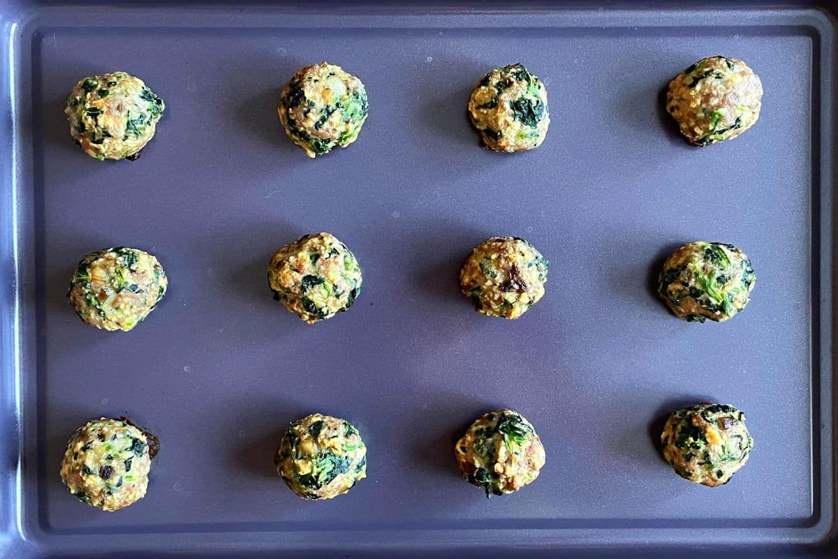Baked turkey meatballs on sheet pan.