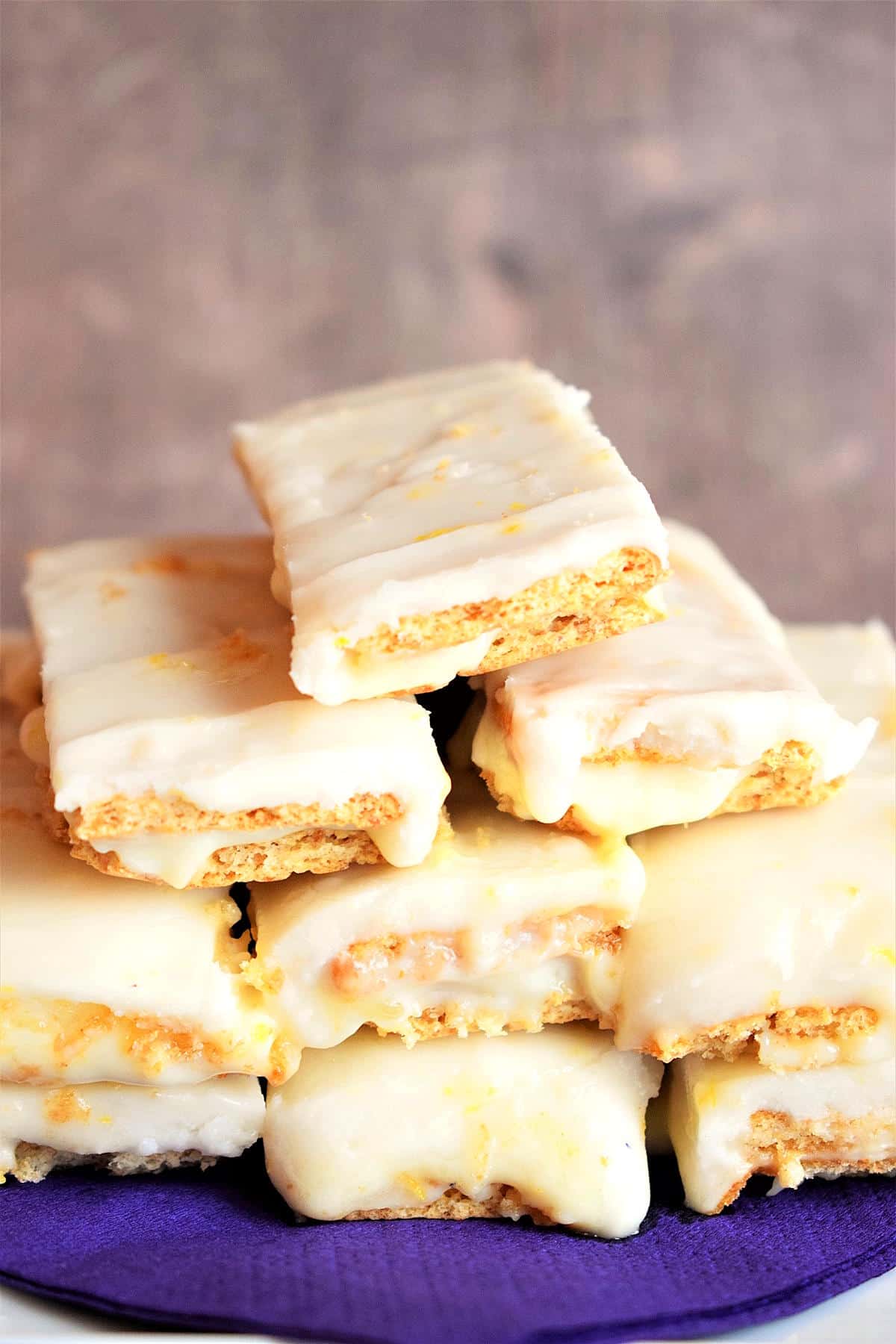 Graham wafer lemon bars stacked on top of each other.