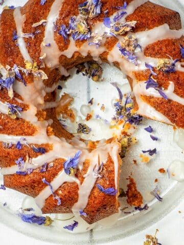 Grapefruit cake with dried edible flowers and icing drizzle.