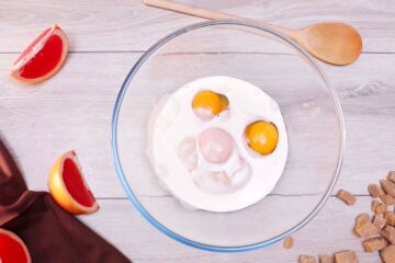 Eggs and buttermilk in bowl.
