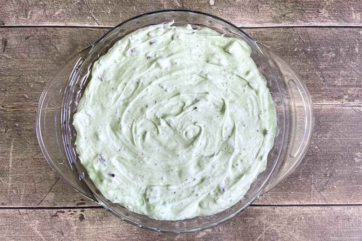 Grasshopper pie filling in pie dish.