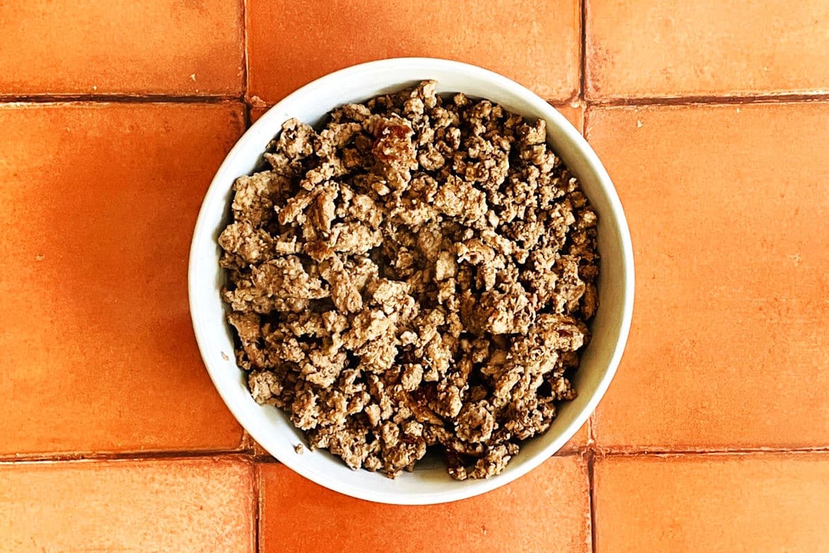 Browned ground beef in bowl.