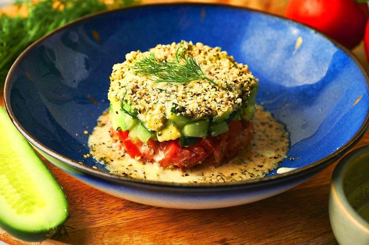 Hemp seed salad on blue plate.