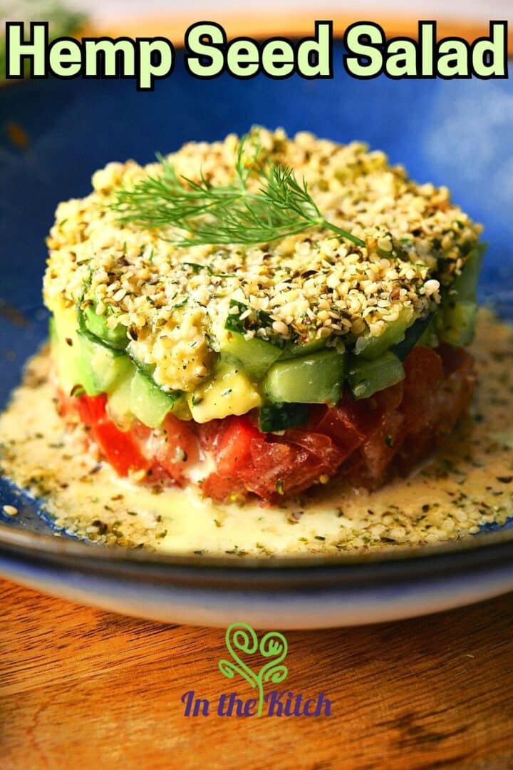 Hemp seed salad stacked on blue plate with text overlay that says 'hemp seed salad.