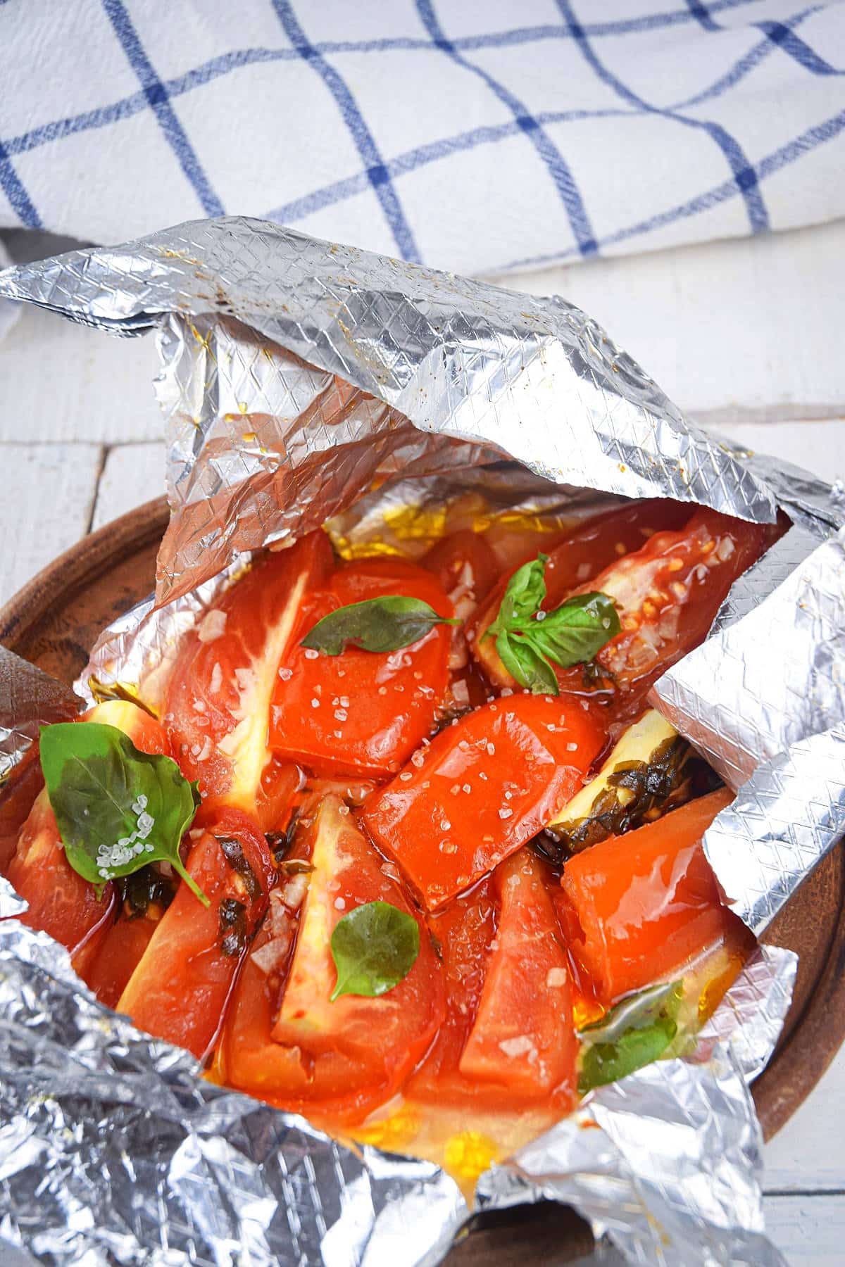 Grilled Roma tomatoes in foil pack.