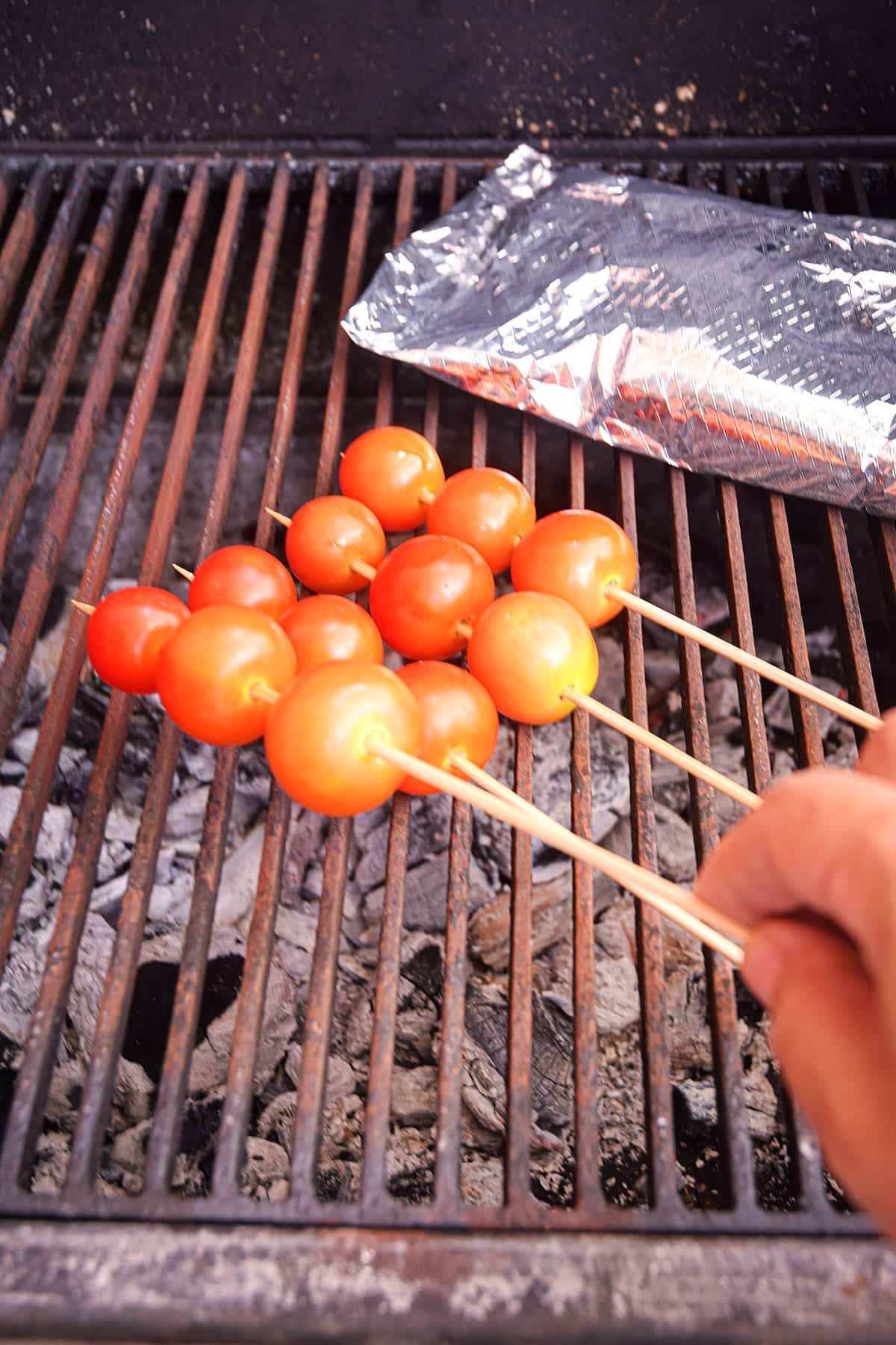 Tomato foil pack on grill.