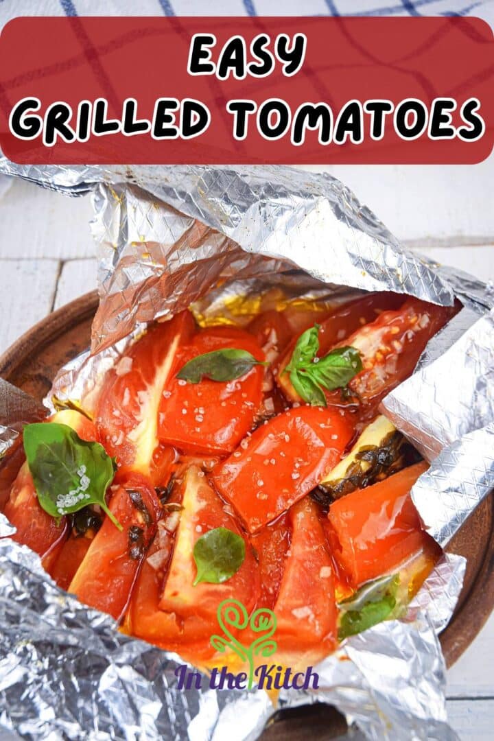 Grilled tomatoes in foil pack with text overlay that says 'Easy Grilled Tomatoes'.