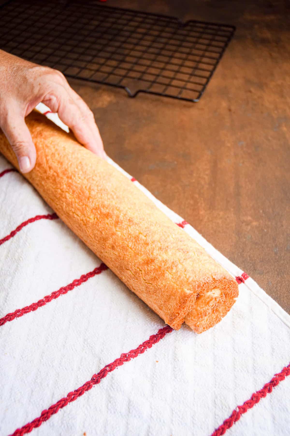 Jelly roll cake rolled up with filling.