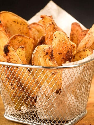 Cajun French fries in basket.