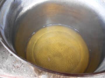 Cooked down maple water in pot.