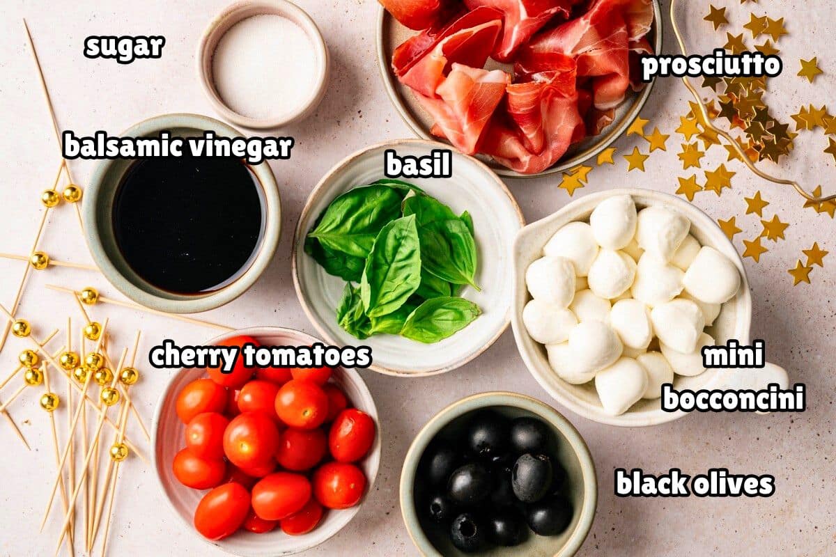 Mini caprese skewer ingredients prepped and labeled.