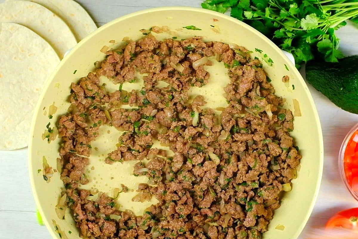 Ground beef in pan.