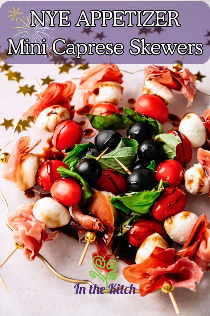 Mini caprese skewers on plate with text overlay that says 'NYE Appetizer - Mini Caprese Skewers'.