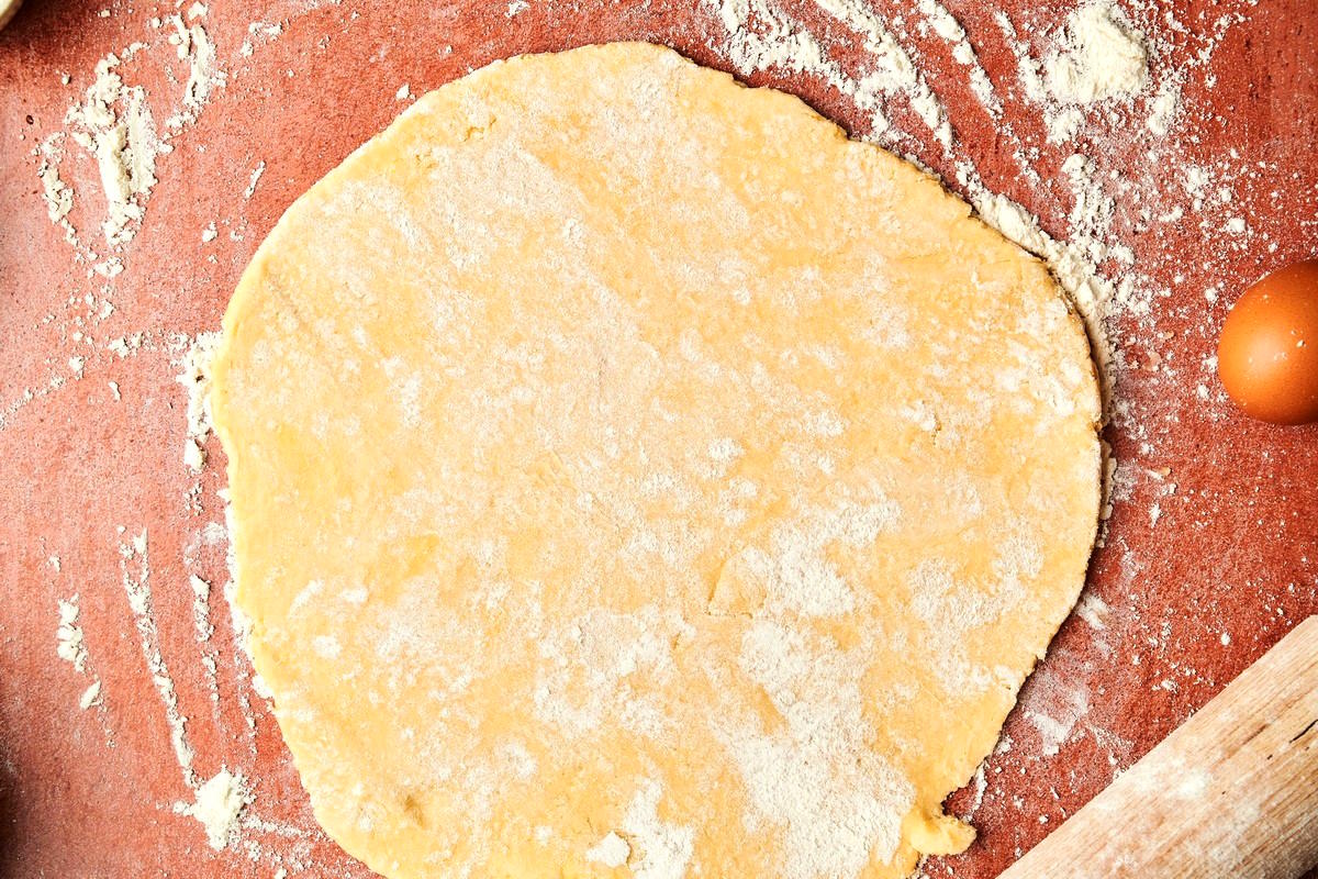 Galette dough rolled out on floured surface.