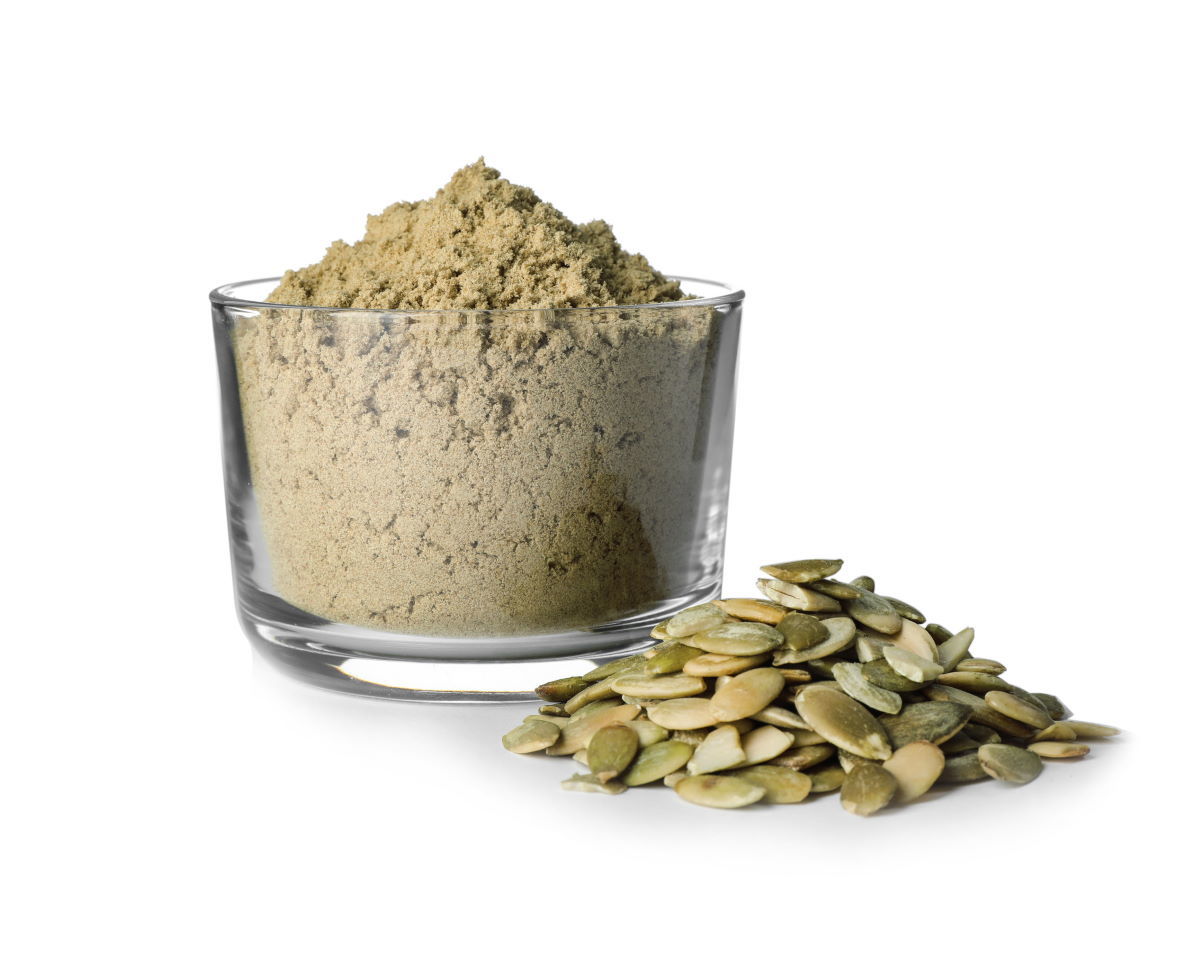 Pumpkin seed powder in a glass bowl.