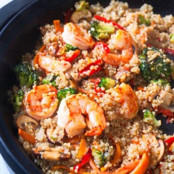Quinoa stir fry in skillet.