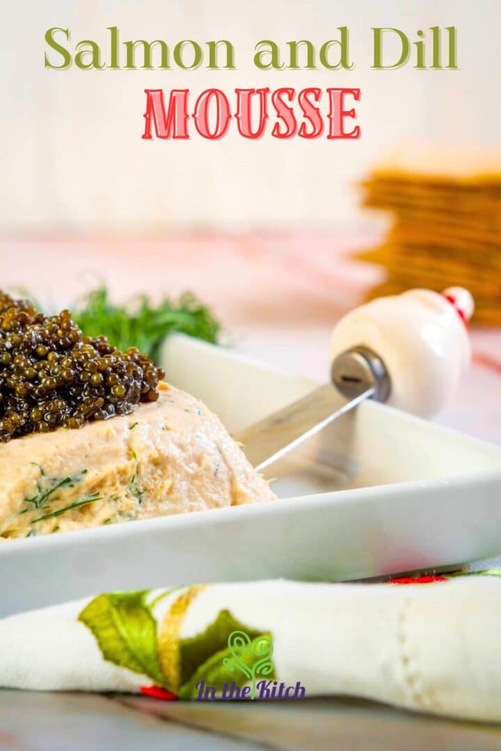 Salmon mousse with caviar in white dish.