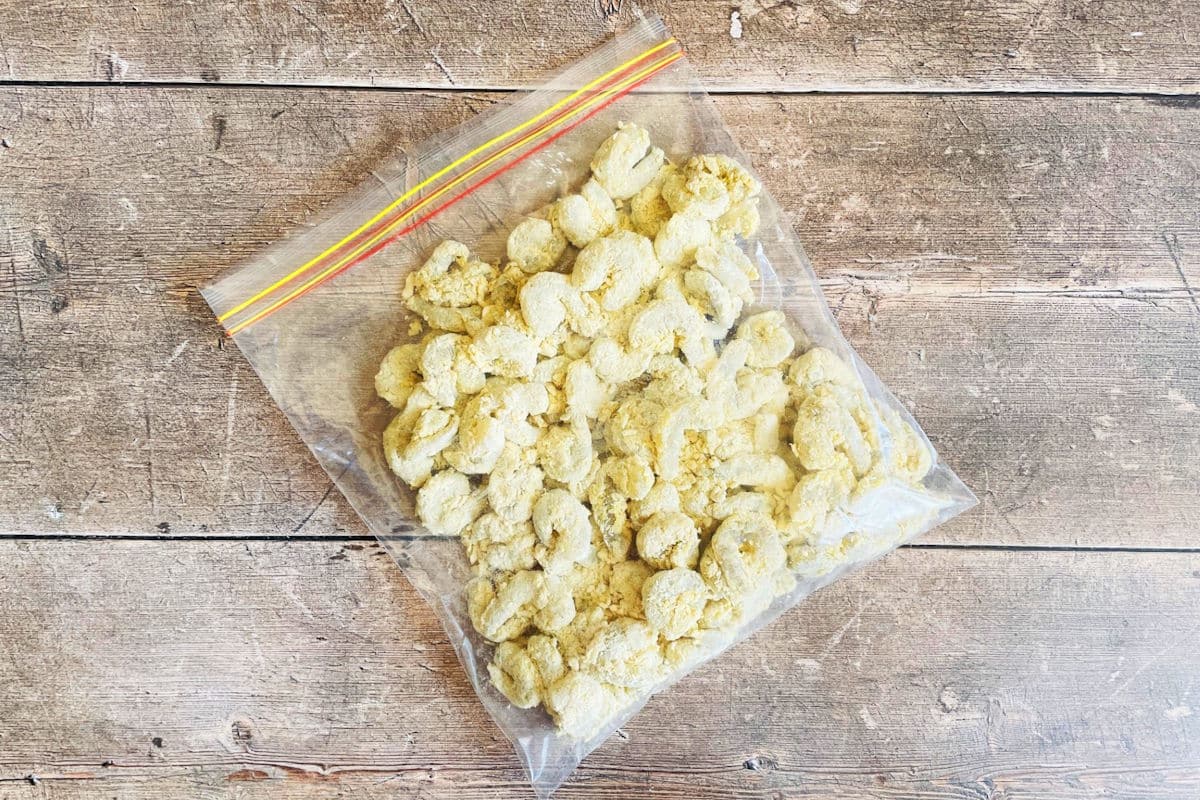 Coconut coated raw shrimp in ziptop bag.