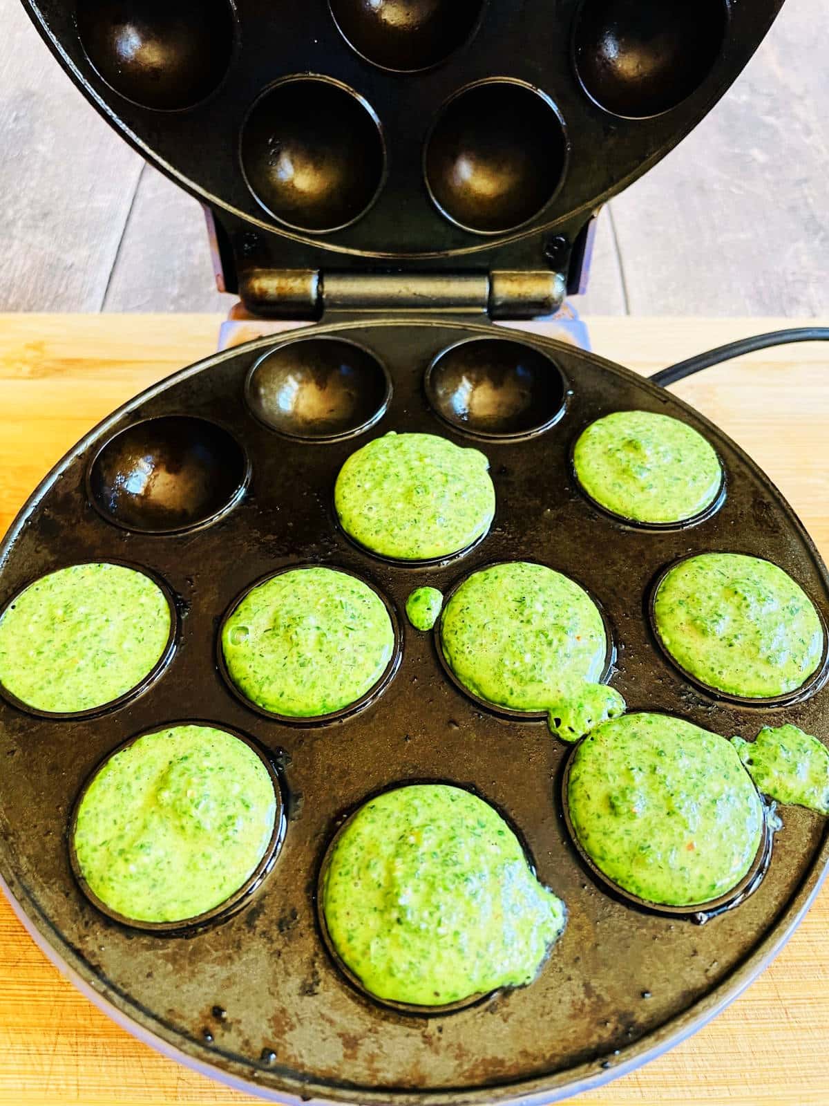 Egg bites mixture in cake pop maker.