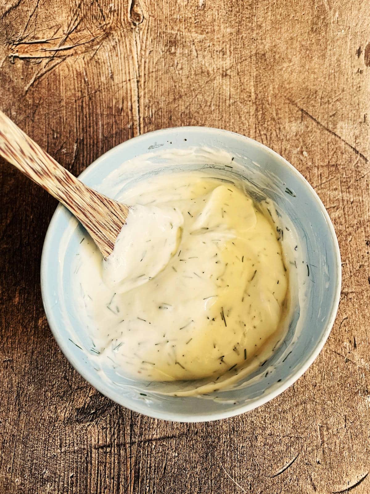 Greek yogurt egg bite dip in bowl with spoon.