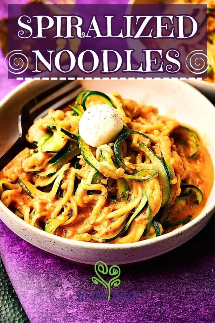 Keto zucchini noodles in bowl with text overlay that says 'Spiralized Noodles'./