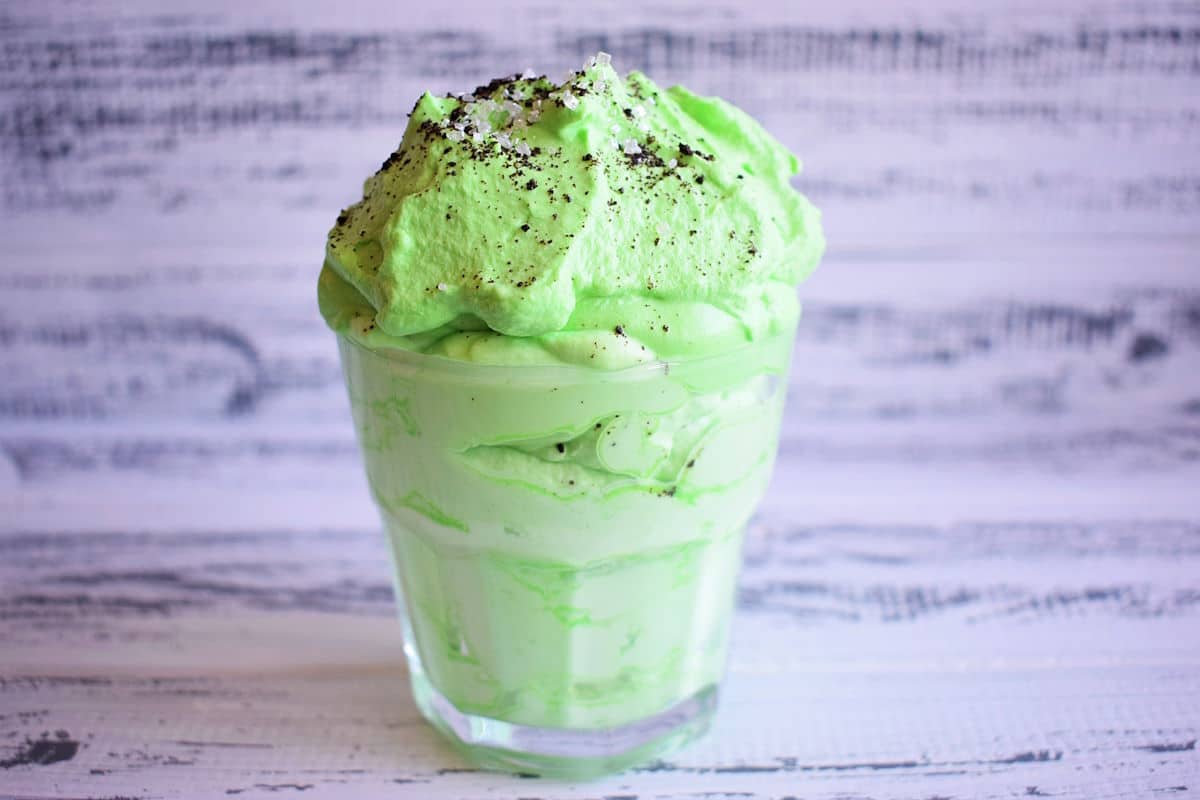Green peppermint whipped cream in glass.