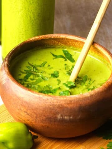 Tomatillo hot sauce in a small wooden bowl.