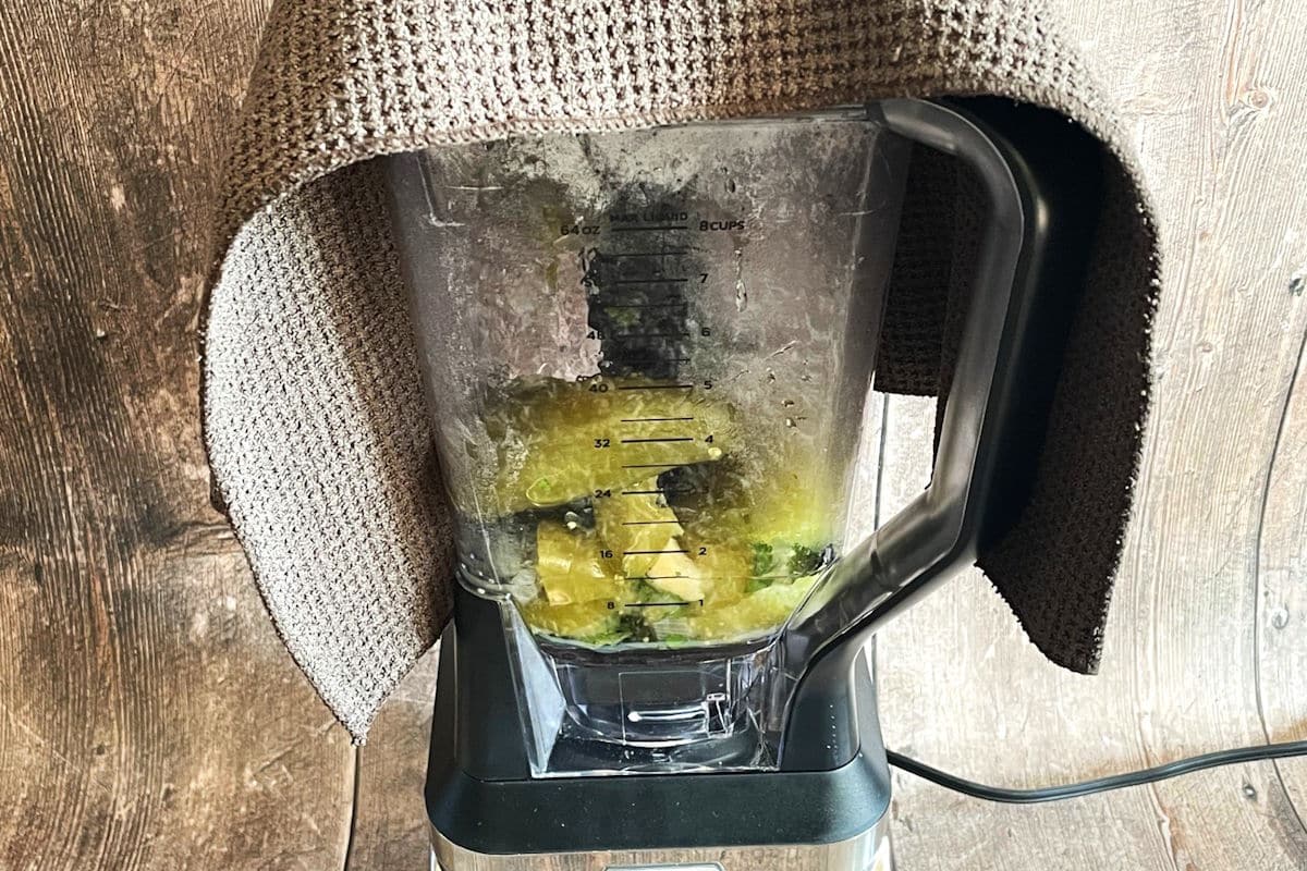 Tomatillo hot sauce ingredients in blender.