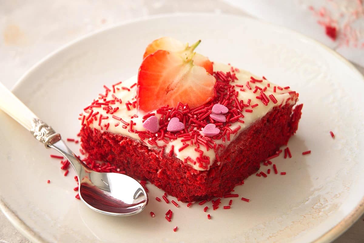 Valentine's Day cake slice on white plate.