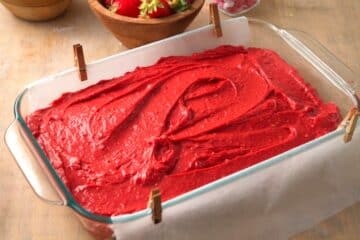 Red velvet cake batter in pan.