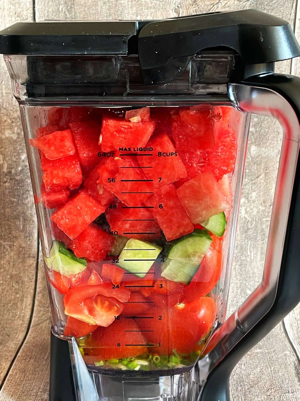 Watermelon gazpacho ingredients in blender.